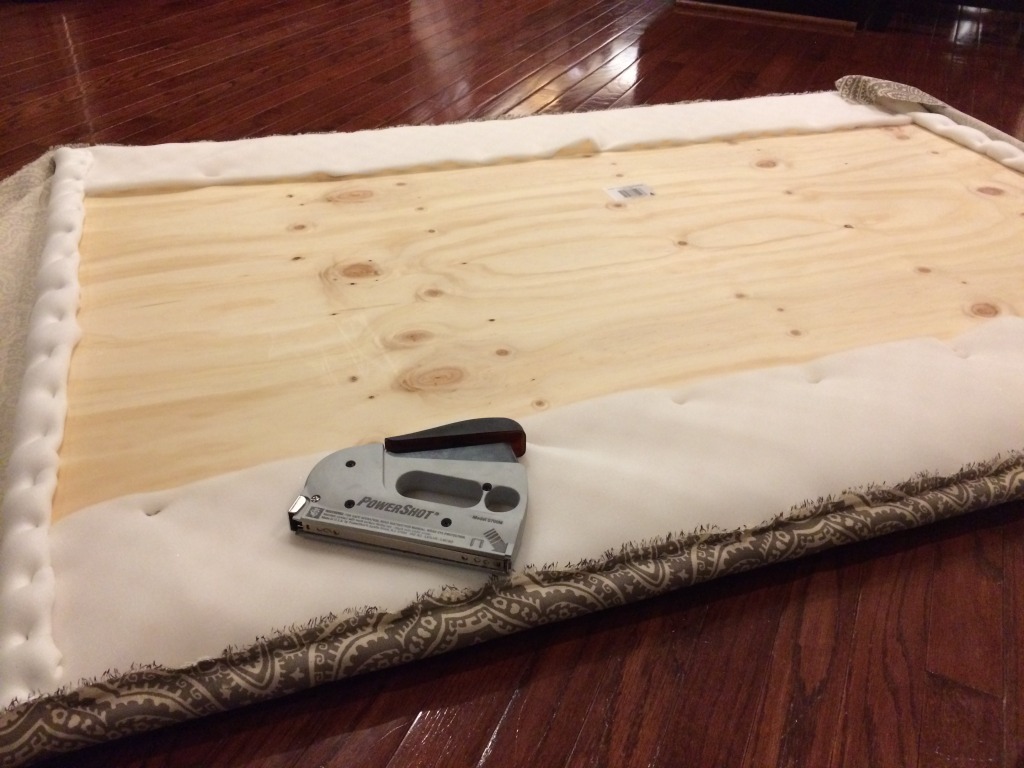 Then I stapled all the layers onto the wood.